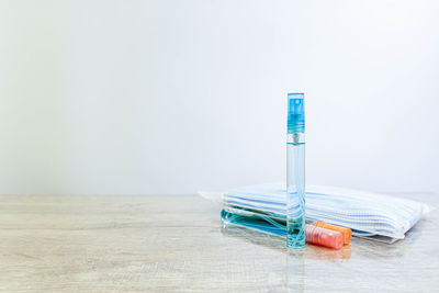 Close-up of multi colored pencils on table against white background