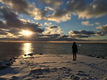 Scenic view of sea at sunset