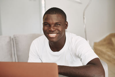 Portrait of young man using smart phone