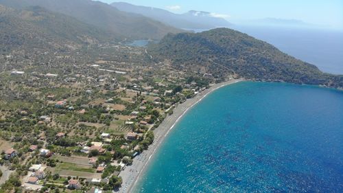 High angle view of swimming pool by sea against sky