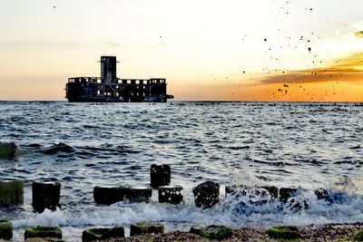 Scenic view of sea against sky during sunset