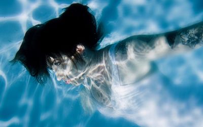 Woman swimming in pool