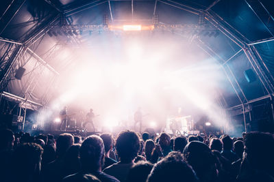 Rear view of people enjoying music concert