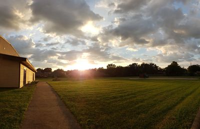 Scenic view of field against sky during sunset