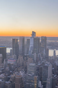 Cityscape against clear sky during sunset