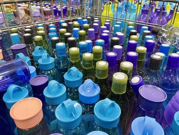 Close-up of multi colored bottles