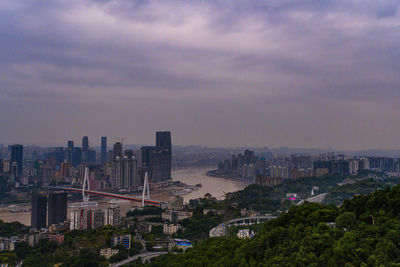 High angle view of buildings in city against sky