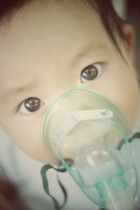 Close-up portrait of boy drinking glass