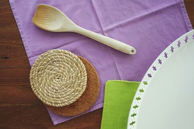 Directly above shot of place mats with spoon on table