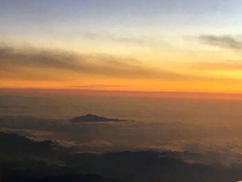 Scenic view of landscape against sky during sunset
