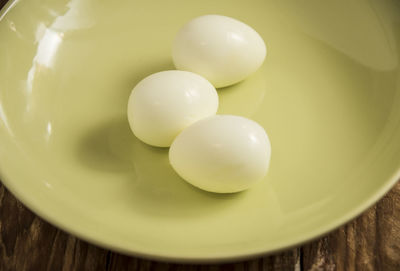 High angle view of eggs in bowl on table
