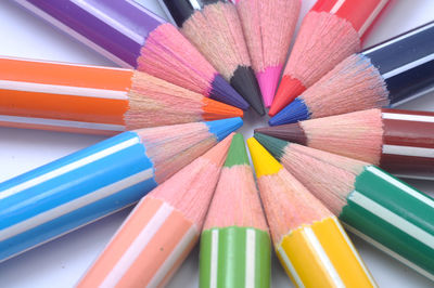 Close-up of colored pencils on table