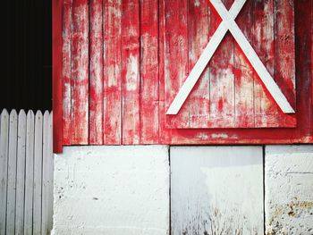Close-up of red closed barn door
