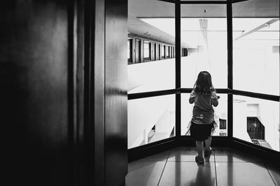 Woman standing against wall