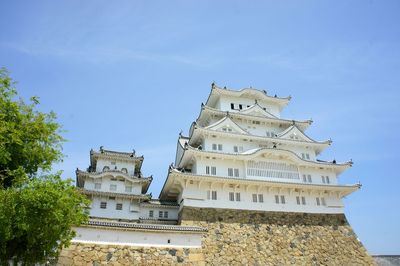 Low angle view of building against blue sky