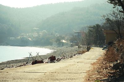 Scenic view of river by mountains