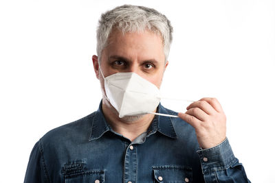 Portrait of man against white background