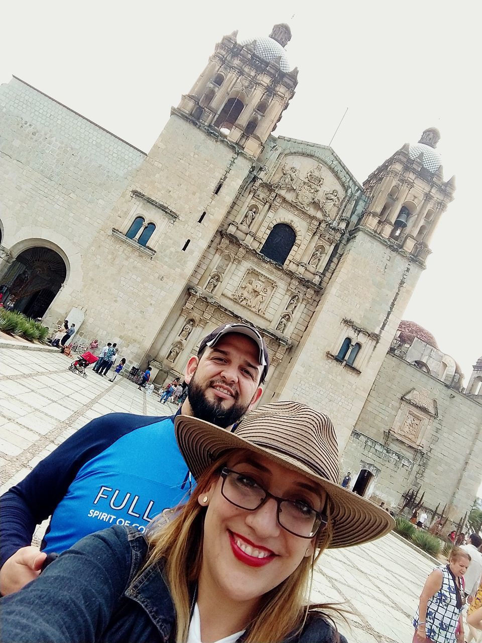 architecture, two people, building exterior, built structure, portrait, young adult, men, young men, women, real people, young women, city, couple - relationship, looking at camera, lifestyles, togetherness, adult, leisure activity, people, low angle view, outdoors, positive emotion