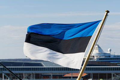 Low angle view of flag against sky