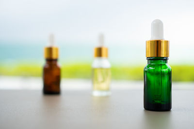 Close-up of glass bottle on table