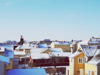 Residential buildings against clear blue sky