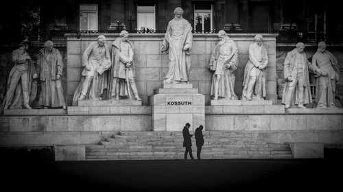 Statue of people at historical building