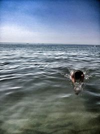 Man swimming in sea