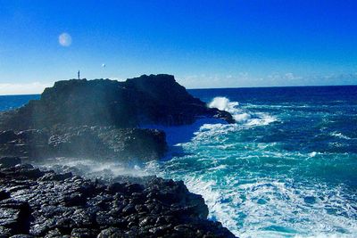 Scenic view of sea against clear blue sky