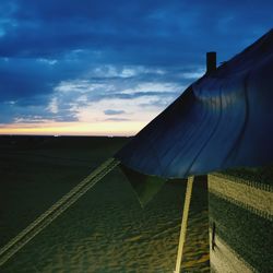 Scenic view of field against sky during sunset