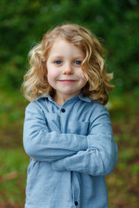 Portrait of smiling girl standing outdoors