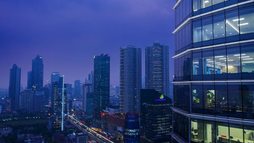 Illuminated buildings in city at night