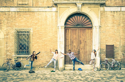 Group of people against built structure