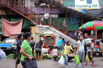 People at market stall in city