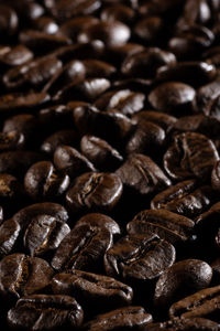 Roasted coffee beans closeup background vertical.