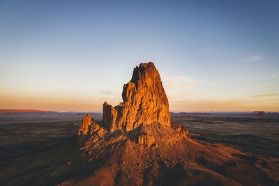 Aerial view of agathla peak in the morning from above, arizona