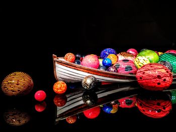 High angle view of multi colored pencils on table against black background