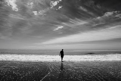 Rear view of woman on beach