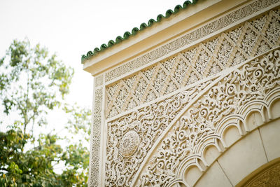 Low angle view of morrocan ornate building against sky