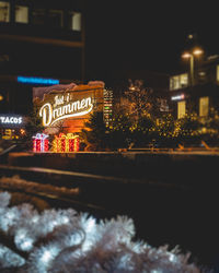 Illuminated buildings in city at night