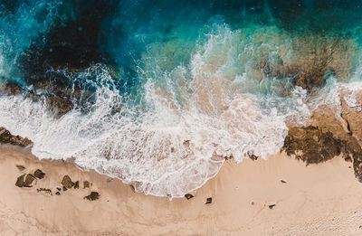 Sea waves splashing on rocks