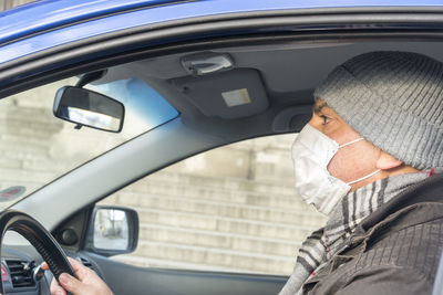 Portrait of man in car