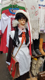 Full length of woman wearing hat standing outdoors