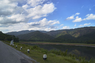 Empty road along countryside landscape