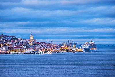 View of lisbon view over tagus river with yachts and boats in the evening. lisbon, portugal