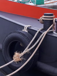 Rope tied to boat at harbor