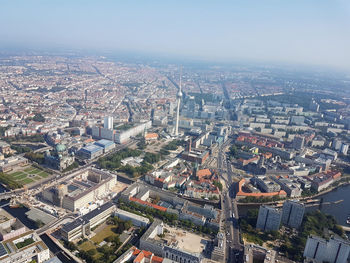 High angle view of illuminated city buildings against sky