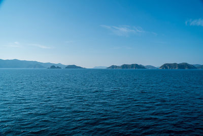 Scenic view of sea against blue sky