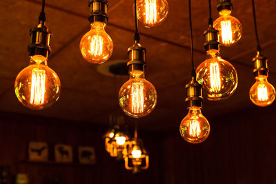 Low angle view of illuminated light bulb