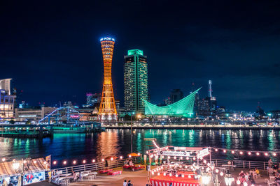 Illuminated modern buildings in city at night