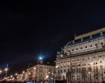 Low angle view of illuminated buildings at night